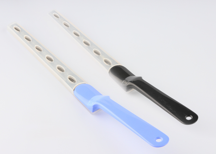 Paper knife with a cap